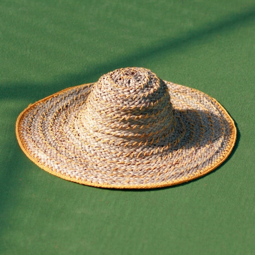 "Get Summer Ready with Our Stylish Yellow Balinese Pecatu Wide Round Straw Hat"