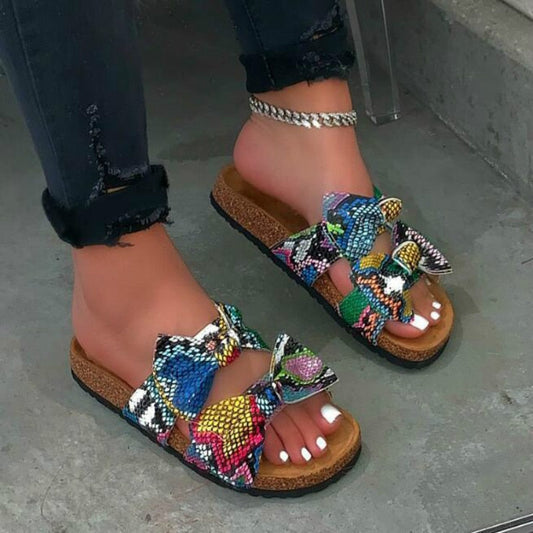 "Step into Style: The Ultimate Comfort and Chicness of Our Women's Slides with Bow Detailing"