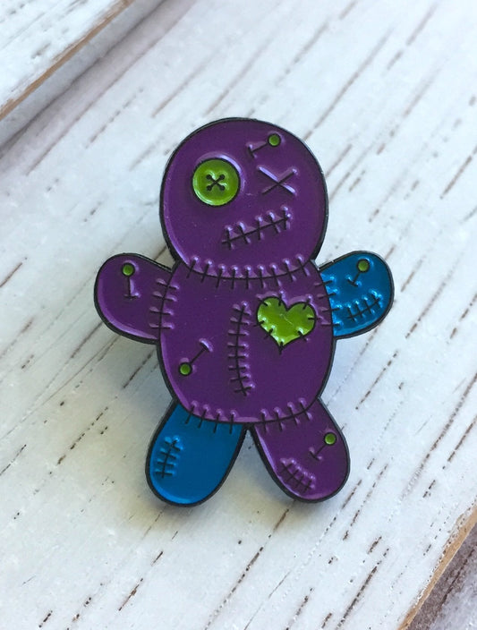 "The Perfect Accessory: Unleash Your Inner Witch with Our Voodoo Doll Enamel Pin!"